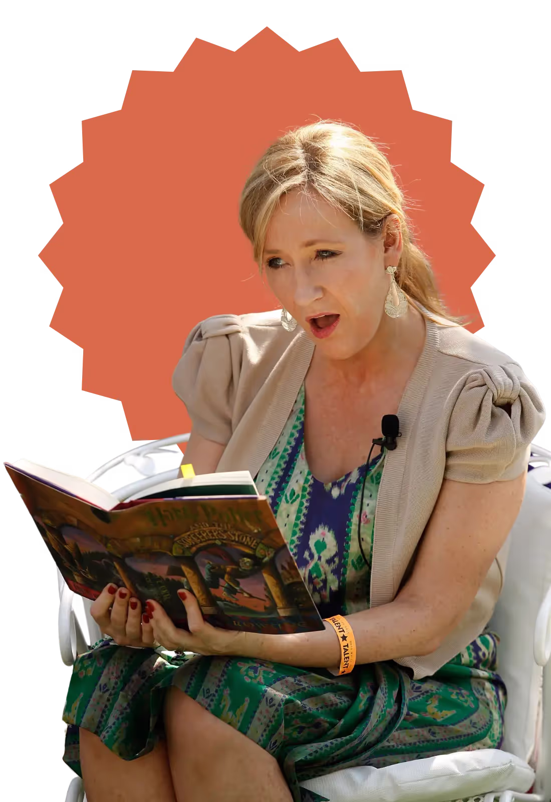 A woman reading a book with a green and white dress.